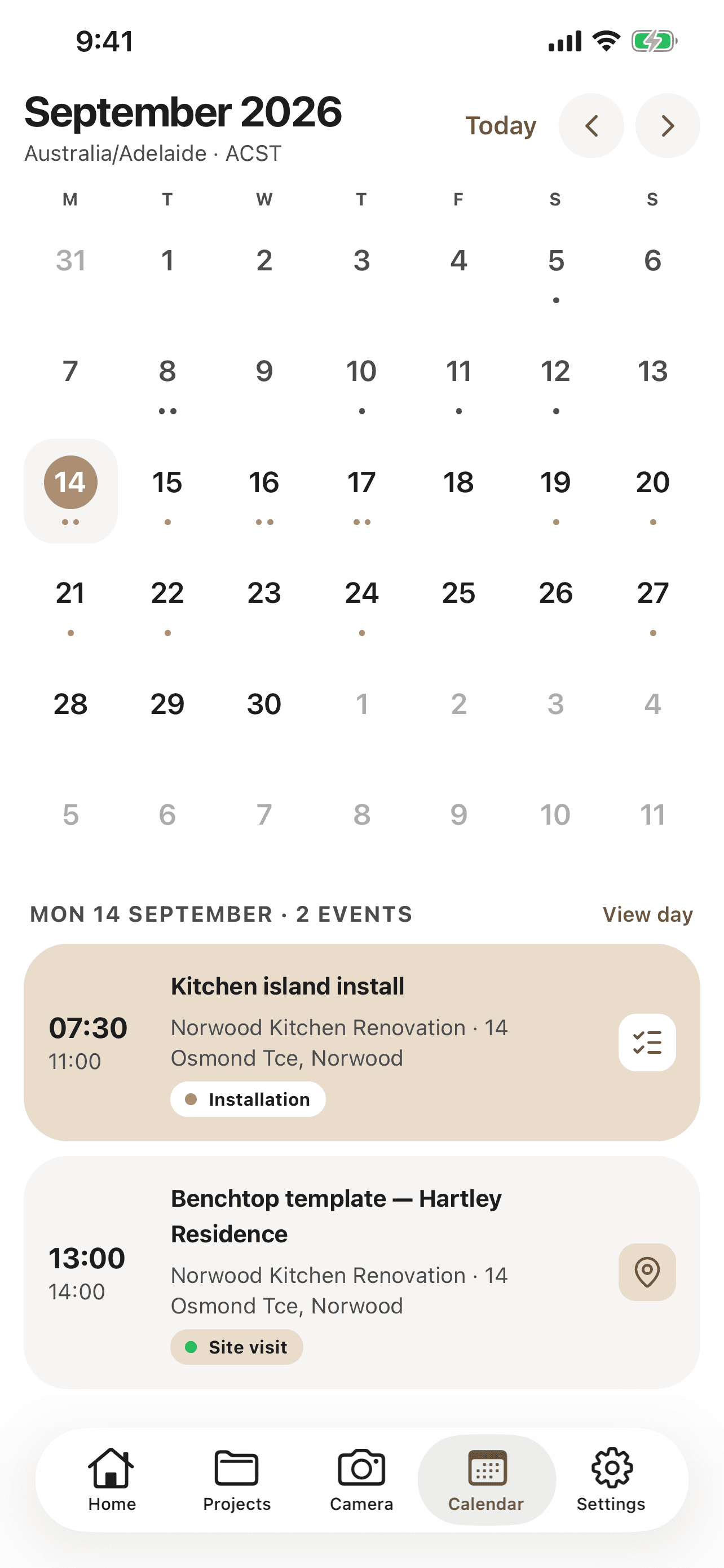 CabiPro calendar screen on iPhone showing September 2026 in month view with two events on the selected day: a kitchen island install and a benchtop template site visit.
